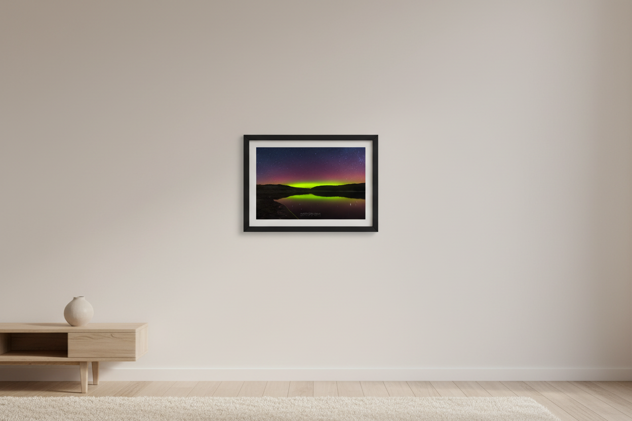 Small fine art print of full-sky crimson aurora dome with brilliant lime green horizon band reflecting in glassy North Bar Lake symmetrical valley bowl composition Sleeping Bear Dunes displayed in modern living room
