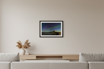 Small fine art landscape print of rare S.T.E.V.E. and Picket Fence aurora with vivid green curtains and purple arc sweeping across a deep blue star-filled sky over Little Glen Lake at Glen Arbor Narrows on M-22 Michigan September 4 2022 displayed in modern living room