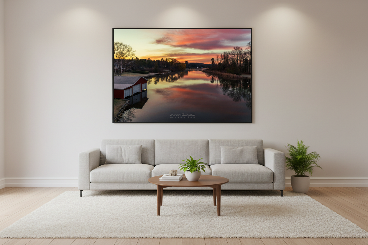 Large fine art landscape print of reflective fiery sunrise over Lake Leelanau Narrows with red boathouse Leelanau County Michigan November 2023 displayed in modern living room
