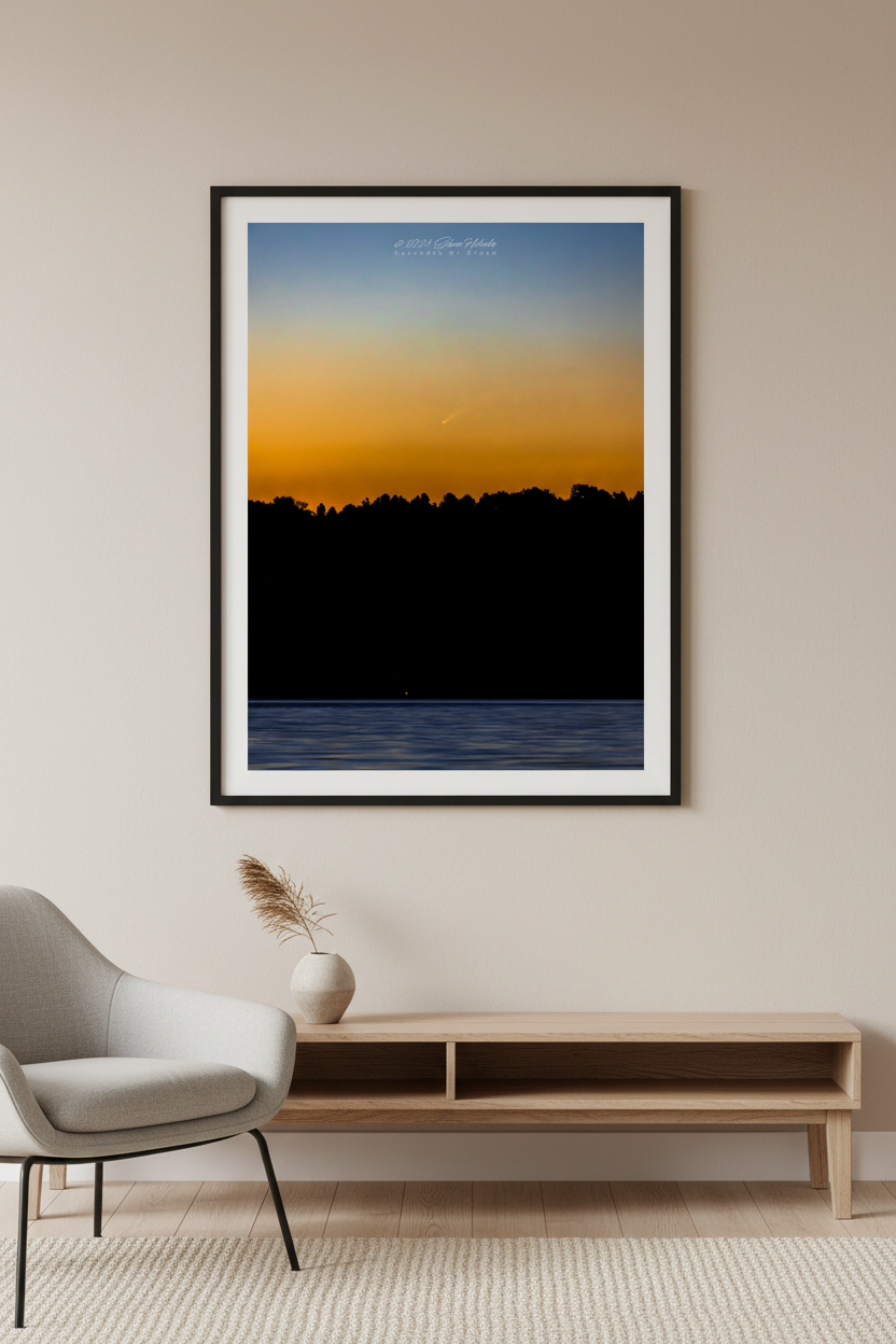 Large fine art portrait print of Comet Tsuchinshan-ATLAS C/2023 A3 rising over Lake Leelanau at sunrise golden amber orange sky treeline silhouette near-black water Leland Michigan Sep 29 2024 displayed in modern living room