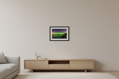 Small fine art landscape print of vivid green yellow and purple Northern Lights aurora borealis reflecting in calm Lake Michigan water at Christmas Cove Beach Northport Michigan September 18 2023 at 11:14pm displayed in modern living room