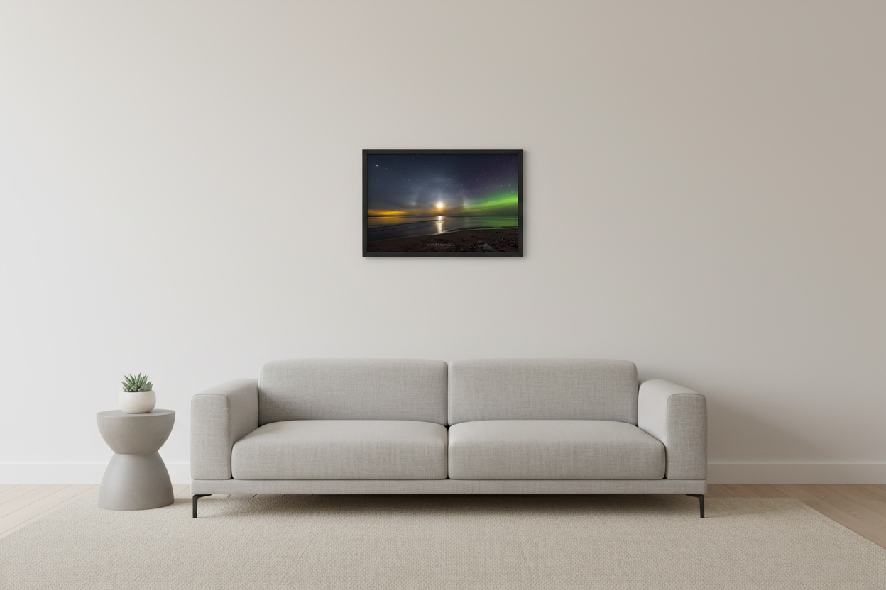 Small fine art landscape print of rare lunar halo and moon pillars with glowing full moon over calm lake casting golden moonpath on water with vivid green Northern Lights on right and warm golden airglow on left horizon at Esch Beach Sleeping Bear Dunes Michigan February 27 2023 displayed in modern living room